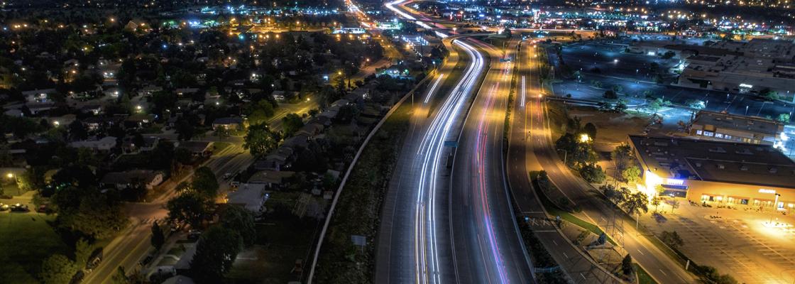 At night, cars use a major road in the Denver suburb of Aurora, Colorado.