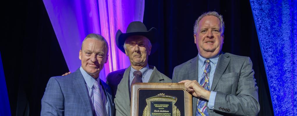 From left to right: Douglas W. Rex, Herb Atchison, Steve Conklin. Photo taken at the DRCOG Annual Awards Celebration. Shows Herb holding his John V. Christensen award.
